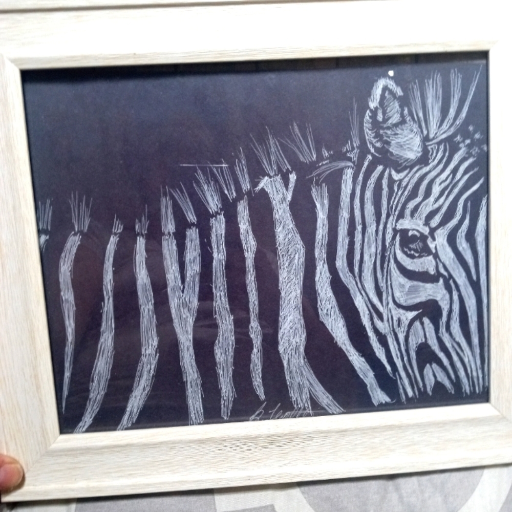 Zebra front is a drawing done on black paper with white gel pen 8" x 10"